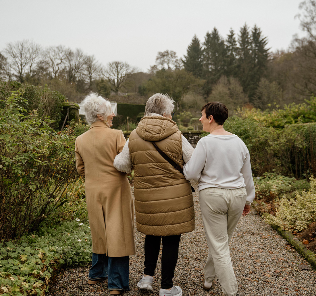 Women walking through Illest Gardens